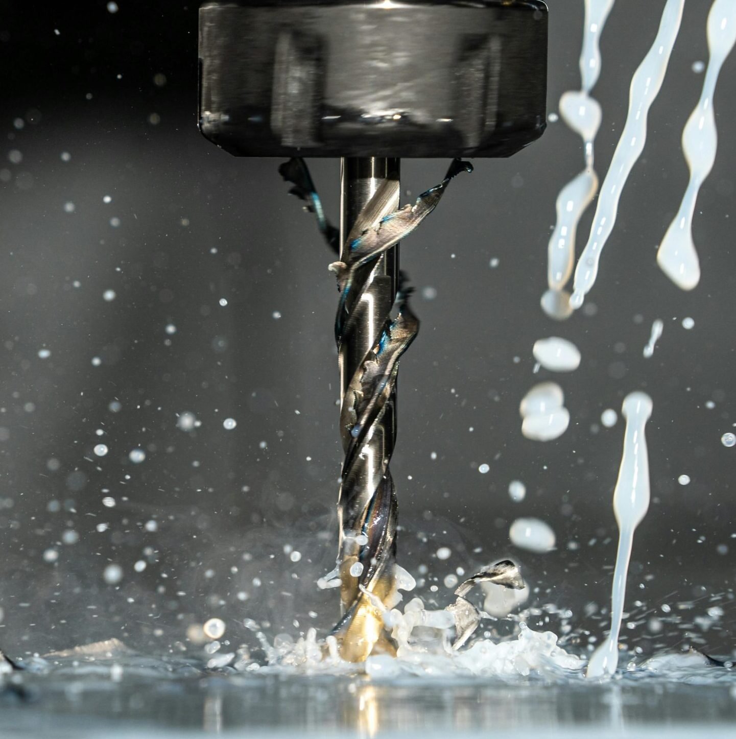 Close Up Phot of a CNC Milling Machine with Metalworking Fluid